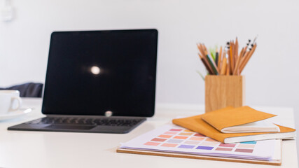 Designer computers and design equipment are placed on their desks to get them ready for work after a day's rest. concept for getting freelance jobs for designers in the online era