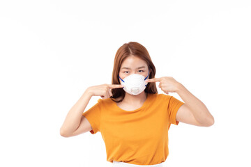 Young Asian woman wearing face mask, mask mouth protect filter pm2.5 anti pollution, anti smog and protection covid 19. Air pollution, environmental concept.