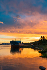 Fototapeta na wymiar beautiful sunset sky with the silhouette of a ship in the foreground