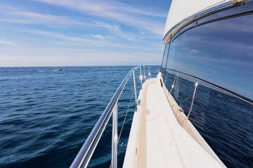 Obraz premium Luxury motor yacht in the azure Mediterranean sea at full speed.Expensive yacht.