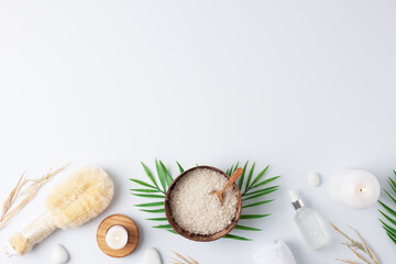 Spa treatment with natural skin care products flowers, towel and bowl on white background. Flat lay, copy space.