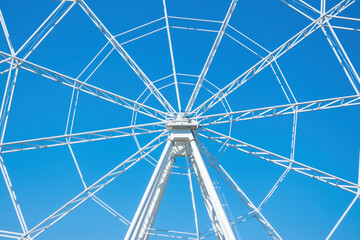 Fragment of ferris wheel on sunny day