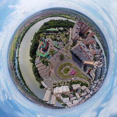 urban landscape minor planet view from a bird's flight height - the full-flowing Kuban river near the western outskirts of the city and the cathedral square at a sunny afternoon - obrazy, fototapety, plakaty
