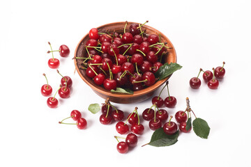 Bowl of fresh red cherries on white background