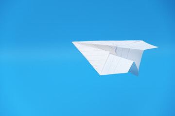 Paper plane against a light blue background