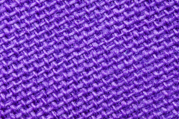 Cotton textile macro detail. Close-up of textured purple tissue cloth weave