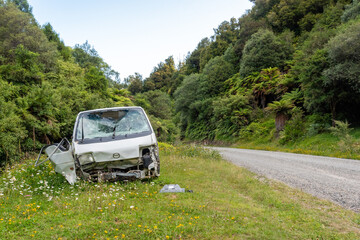 Destructed car after an accident on the road in Te Urewera National Park, New Zealand