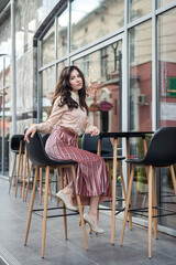 fashion woman posing near cafe, summer time