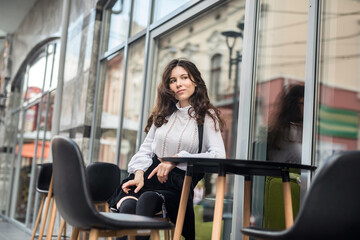 Fototapeta premium fashion woman posing near cafe, summer time