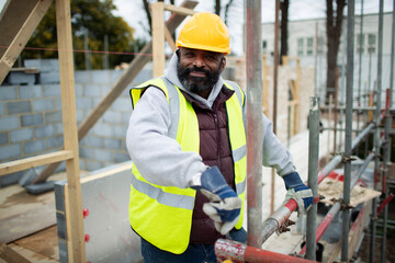 Portrait confident male construction worker at construction site