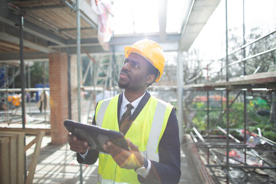Engineer with digital tablet at construction site