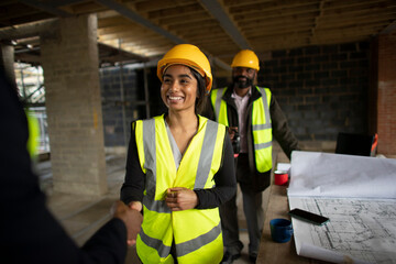 Happy construction workers at construction site