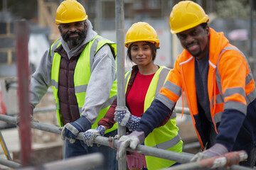 Portrait confident construction workers at construction site