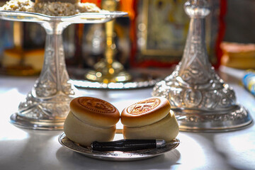 Prosphora, Prosvir, liturgical church bread used during Orthodox worship, silver bowls, an icon on the throne of the Orthodox Church. Christianity, Orthodoxy.
