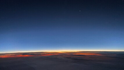 Fototapeta na wymiar Sunrise over the clouds