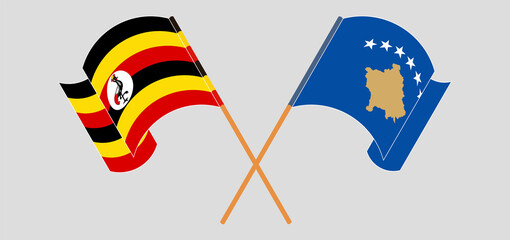 Crossed and waving flags of Uganda and Kosovo