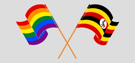 Crossed and waving flags of LGBTQ and Uganda