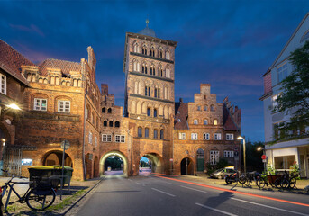 Fototapeta na wymiar Lubeck, Germany. HDR image of Burgtor - historical city gate at dusk 