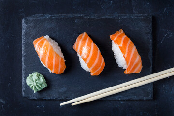 Gourmet sushi served on black slate plate