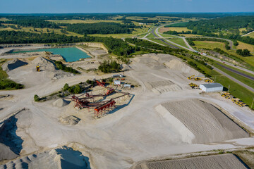 Aerial panorama view of open quarries mining mine extracting with work of machinery equipment