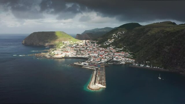 Coastal village of Velas washing by atlantic ocean at Sao Jorge island, Azores