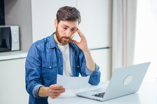 An Unexpected Financial Problem. Surprised Man Reading Bad News