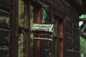 Bird feeder hanging on the wall of an old viking house