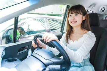 Young woman driving a car