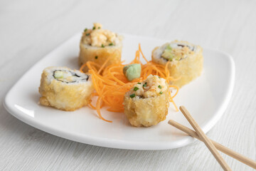 elegant and simple decorated plate with sushi roll, carrot and wasabi, Asian food texture detail in studio, lifestyle