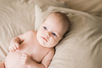 infant baby lying in pillows