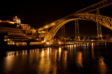Fototapeta na wymiar Night shot of Porto looking towards Vila Nova de Gaia, with the illuminated 