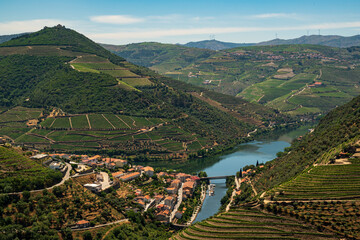 Scenic view of the beautiful Pinhão village surounded by vineyards in the beautiful Douro river...