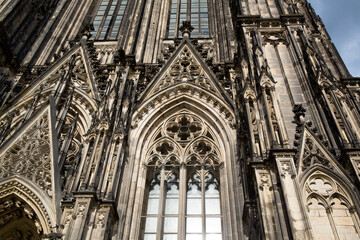 Fototapeta premium Cologne, Germany - June 05, 2021. Facade of the Cathedral Church of Saint Peter, Catholic cathedral in Cologne