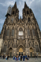Fototapeta premium Cologne, Germany - June 05, 2021. Facade of the Cathedral Church of Saint Peter, Catholic cathedral in Cologne