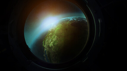 View of planet earth from the porthole from orbit.