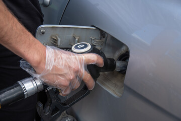 Man fueling compressor with diesel