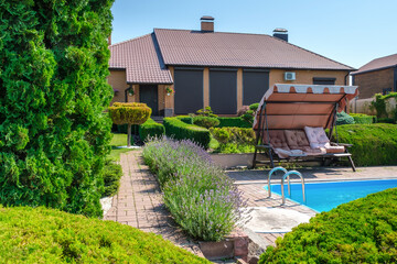 European style villa with pool and garden with nicely trimmed bushes