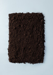 Frame from the ground on blue background. Minimalistic concept compostable or biodegradable with copy space. Pollution reduction idea