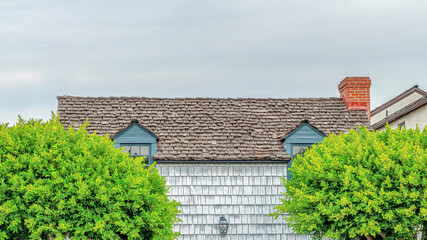 Pano Exterior of homes in the beautiful neighborhood of Long Beach against cloudy sky