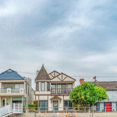 Square Elegant houses overlooking public canal with walkways in Long Beach California
