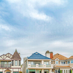 Square Stylish houses with front balconies against cloudy sky in Long Beach California