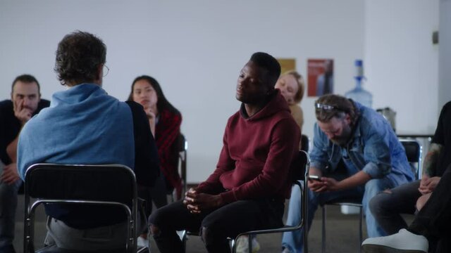 African American man sharing story of gambling addiction