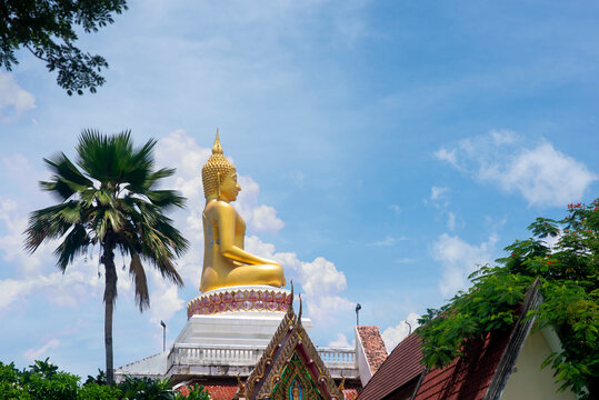 Big Buddha on rooftop in Nong Khai province, Thailand. Low angle.