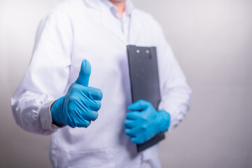 Fototapeta premium Doctor Showing thumbs up for best healthcare and insurance package plan for advertising, healthcare and pandemic concept.