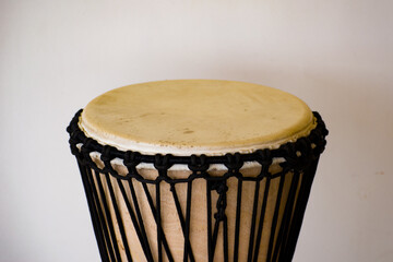 A djembe or jembe is a rope tuned skin covered goblet drum played with bare hands is a percussion...