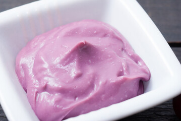 cosmetic cream from red grapes on black wooden