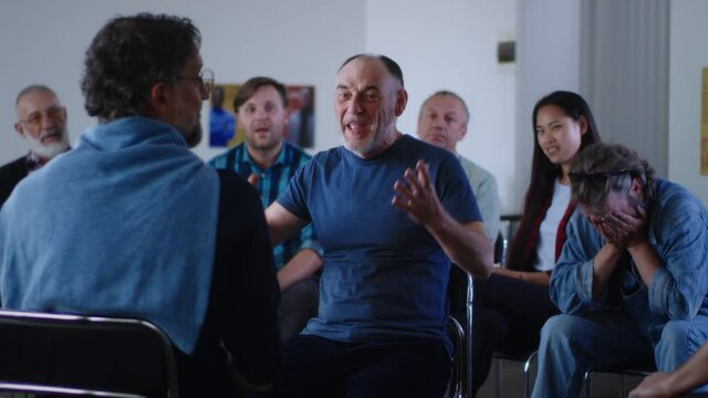 Happy Aged man sharing story of successful addiction overcoming