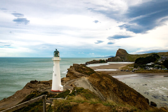 Castlepoint Lighthouse sits high on the cliff overlooking the ocean to guide ships away from the rocks, Wairarapa, New Zealand