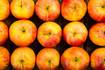 apple fruits in a row, old weathered wood table background
