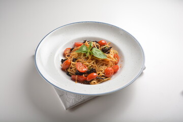 vegetarian sun dried tomato olive oil cook pasta noodle alio olio style in plate on white table hotel fine dining restaurant western halal cafe menu